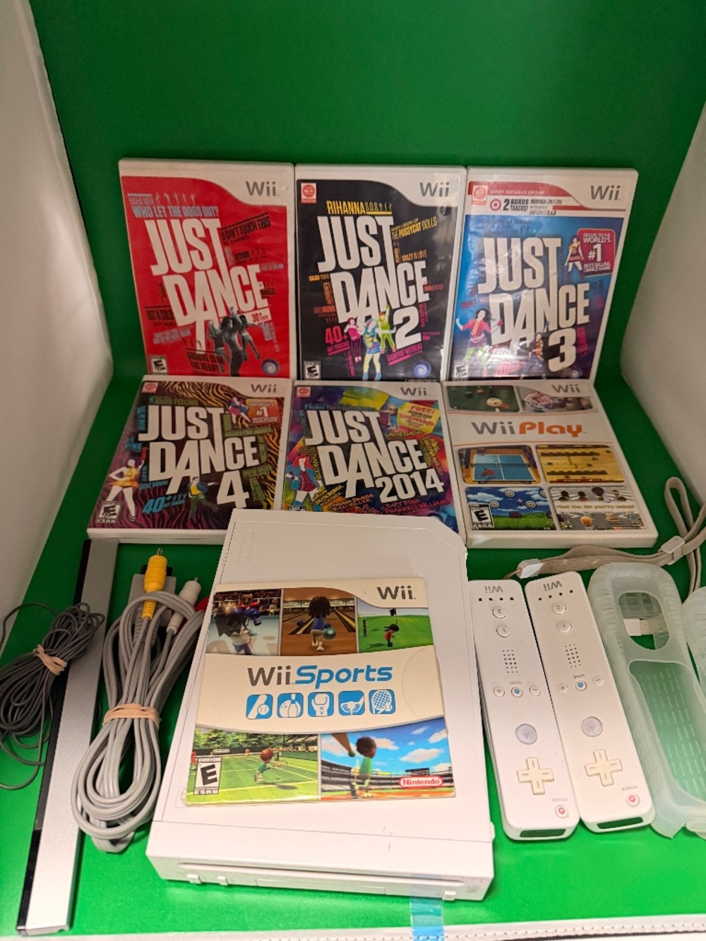 Nintendo Wii Console with Wii Sports and Just Dance lot
